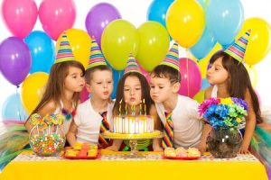 PHOTO OF KIDS BLOWING CANDLES OUT AT PARTY DJ SIME CHILDREN'S PARTY DJ HIRE YORK